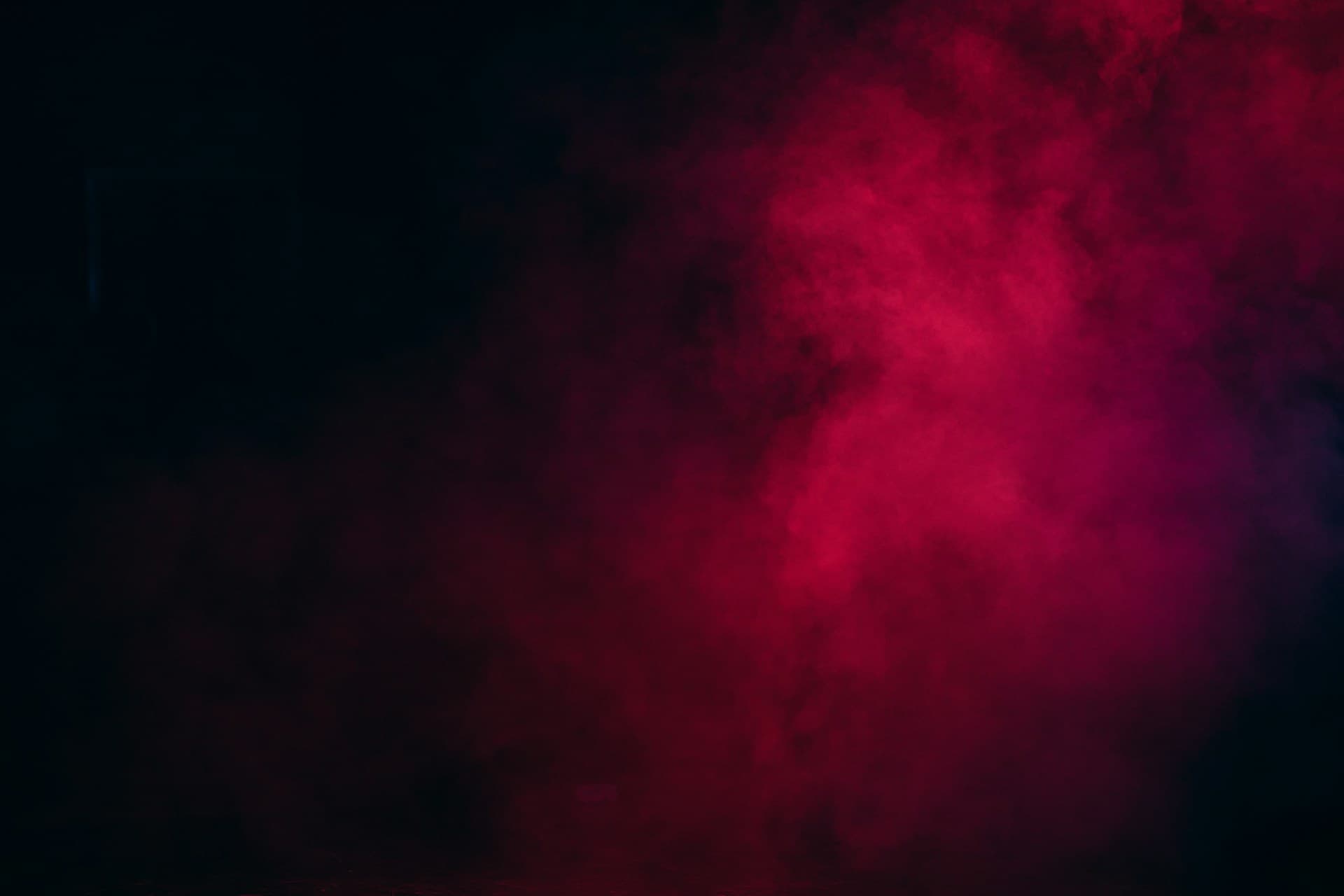 Red mist drifting through the dark